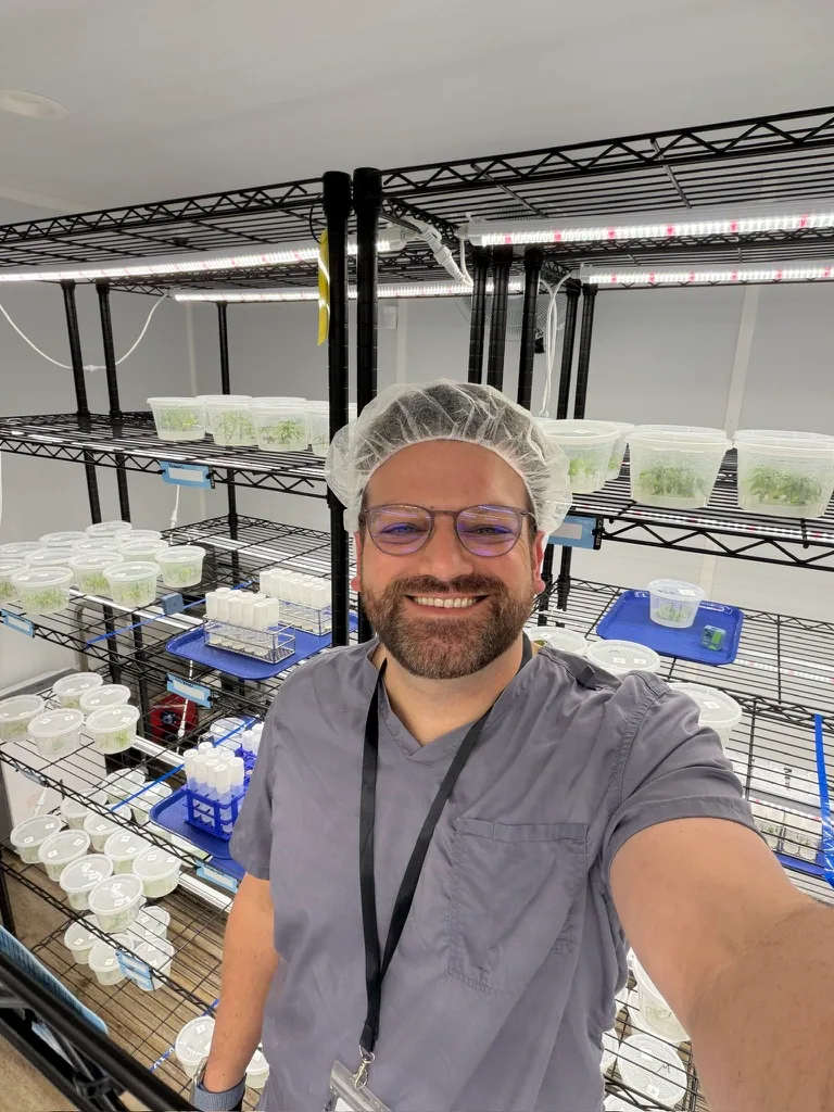 David Stormzand, founder of Collective Herb Consulting, in a tissue culture lab beside racks of culture vessels